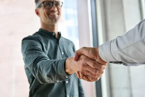 Corporate deal handshake